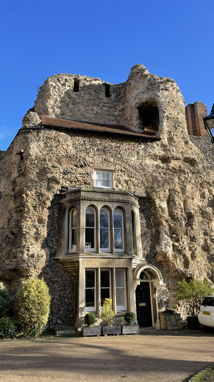 A house built into a castle